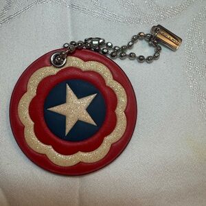 Coach and Marvel.  Captain America Shield purse charm or key ring!